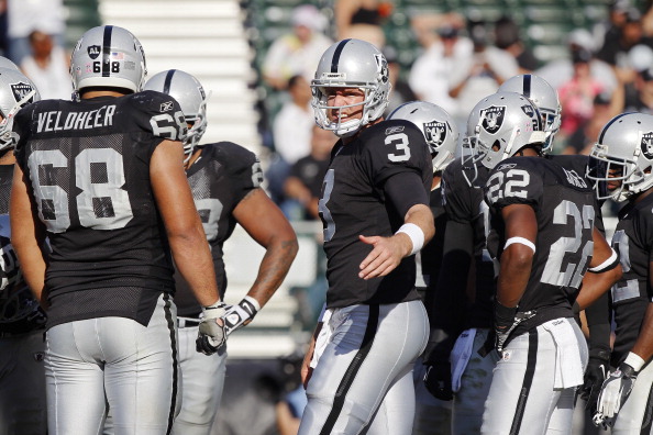OAKLAND, CA - OCTOBER 23: Quarterback Carson Palmer #3 of the Oakland Raiders pulls in the huddle against the Kansas City Chiefs on October 23, 2011 at O.co Coliseum in Oakland, California. The Chiefs won 28-0. 