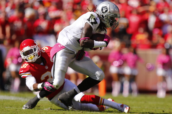 KANSAS CITY, MO - OCTOBER 13: Marcus Cooper #31 of the Kansas City Chiefs defends against Denarius Moore #17 of the Oakland Raiders in the second quarter October 13, 2013 at Arrowhead Stadium in Kansas City, Missouri. (Photo by Kyle Rivas/Getty Images)
