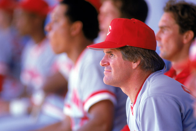 1985:  Pete Rose of the Cincinnati Reds watches from the dug-out during a MLB game in the 1985 season. 
