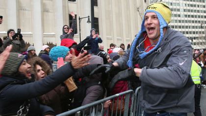 Tight end Rob Gronkowski of the New England Patriots high fives fans. (Photo by Billie Weiss/Getty Images)