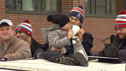 Tom Brady's son kisses the Lombardi trophy. (WBZ-TV)