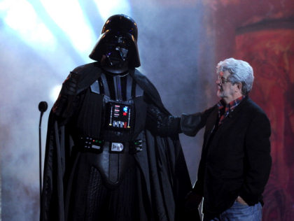 Darth Vader and George Lucas (R) onstage during an award show. (Kevin Winter/Getty Images) 