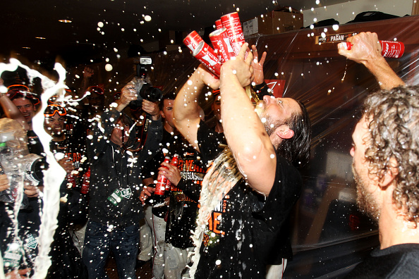  Madison Bumgarner #40 of the San Francisco Giants celebrates in the locker room after their 3 to 2 win over the Washington Nationals in Game Four of the National League Division Series at AT&T Park on October 7, 2014 in San Francisco, California.  (Photo by Ezra Shaw/Getty Images)