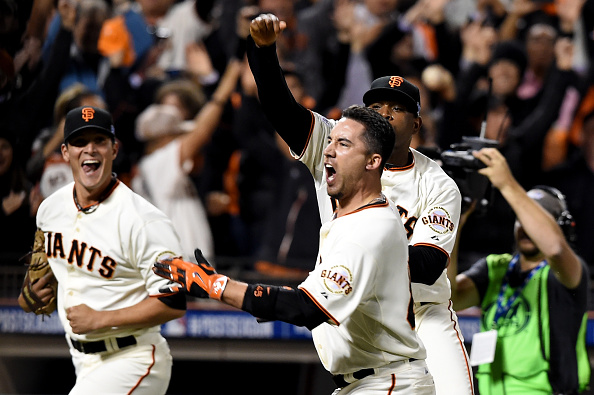  Travis Ishikawa #45 of the San Francisco Giants celebrates after he hits a three-run walk-off home run to defeat the St. Louis Cardinals 6-3 during Game Five of the National League Championship Series at AT&T Park on October 16, 2014 in San Francisco, California.  (Photo by Thearon W. Henderson/Getty Images)