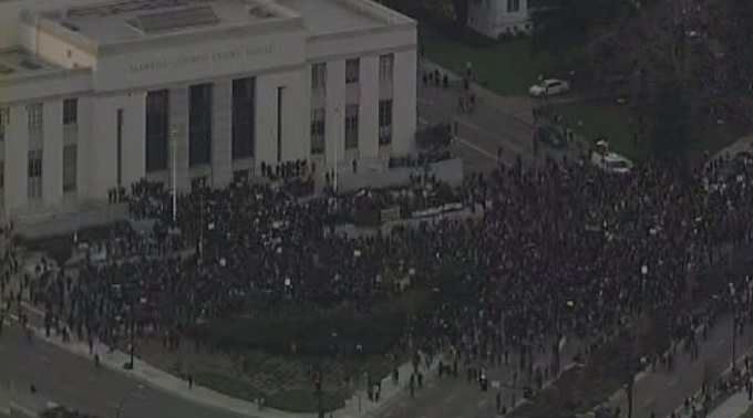 Hundreds of "Millions March" demonstrators gather on the steps of the Alameda County courthouse. 