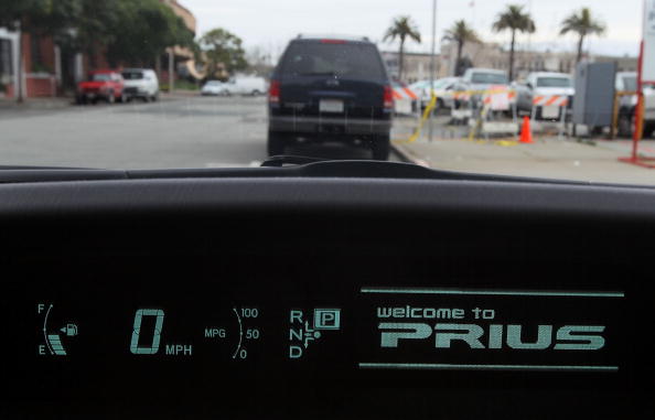 A welcome message is displayed on the dashboard of a 2010 Toyota Prius.  (Photo by Justin Sullivan/Getty Images)
