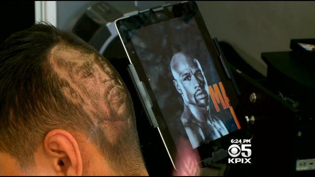Antioch Barber Derek Hernandez working on a Mayweather/Pacquiao haircut. (CBS)