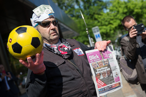 A man jokes about FIFA outside the hotel Baur au Lac Zurich.   (Photo by Philipp Schmidli/Getty Images)
