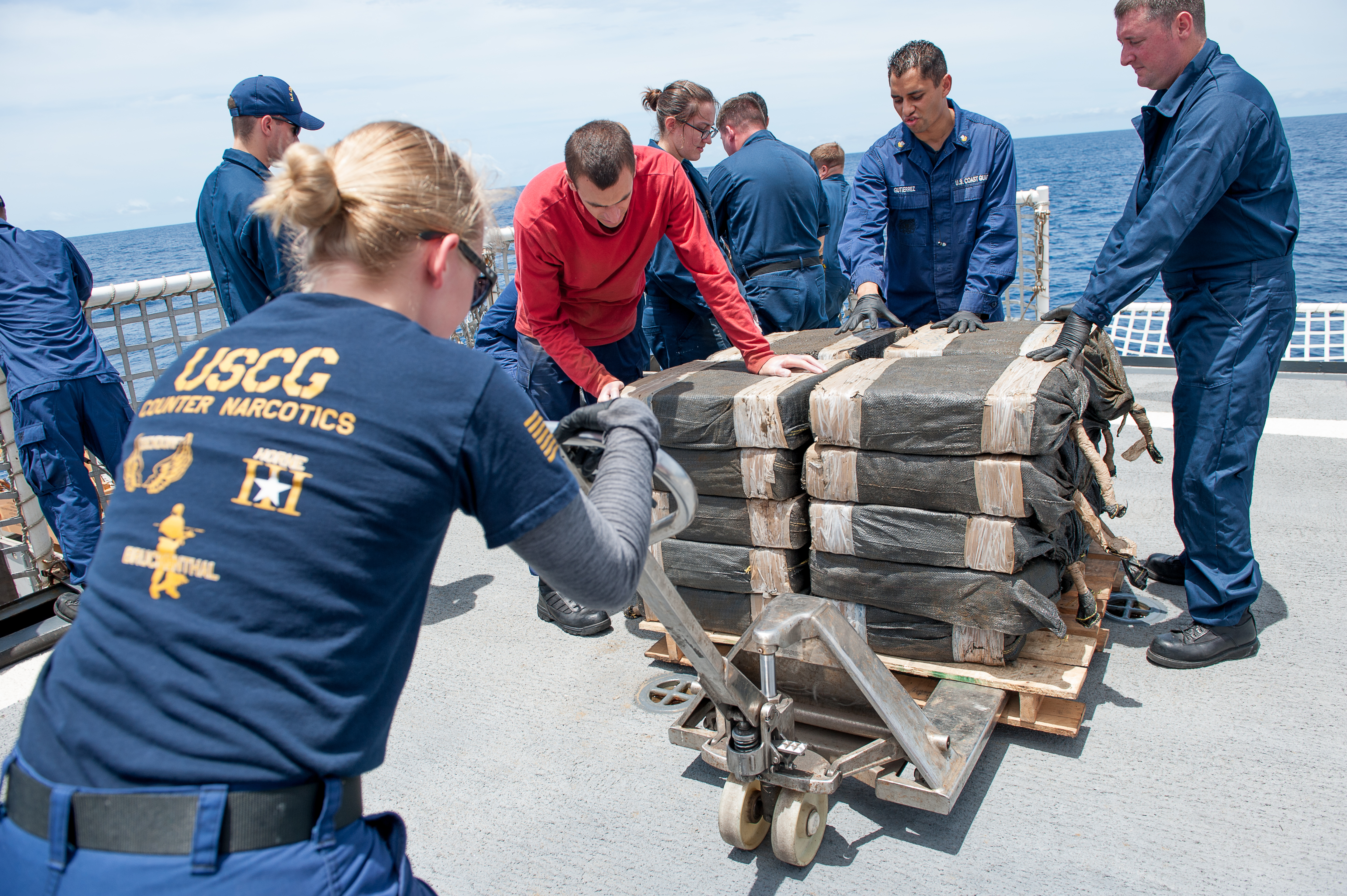 Coast Guard Cutter Stratton crewmembers secure cocaine bales from a self-propelled semi-submersible interdicted in international waters off the coast of Central America, July 19, 2015. The Coast Guard recovered more than 6 tons of cocaine from the 40-foot vessel. (Coast Guard photo courtesy of Petty Officer 2nd Class LaNola Stone)