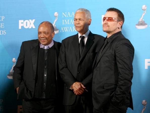 (L-R) Producer Quincy Jones, Chairman of the National Association for the Advancement of Colored People (NAACP) Julian Bond and musician Bono pose in the press room during the 38th annual NAACP Image Awards. (Photo by Frederick M. Brown/Getty Images)