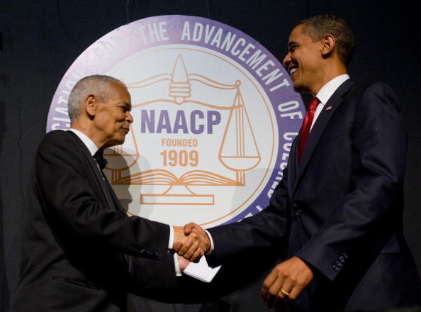 US President Barack Obama shakes hands with NAACP chairman Julian Bond (L) during the NAACP 100th Anniversary convention in New York.  (SAUL LOEB/AFP/Getty Images)