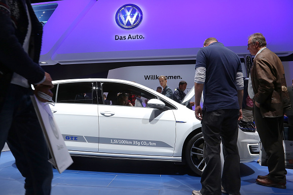 Visitors look at Volkswagen cars at the 2015 IAA Frankfurt Auto Show. Volkswagen CEO Martin Winterkorn apologized to consumers and resigned following allegations by the U.S. Environmental Protection Agency that the company had installed software into its diesel cars sold in the USA that manipulated emissions results. (Photo by Hannelore Foerster/Getty Images)