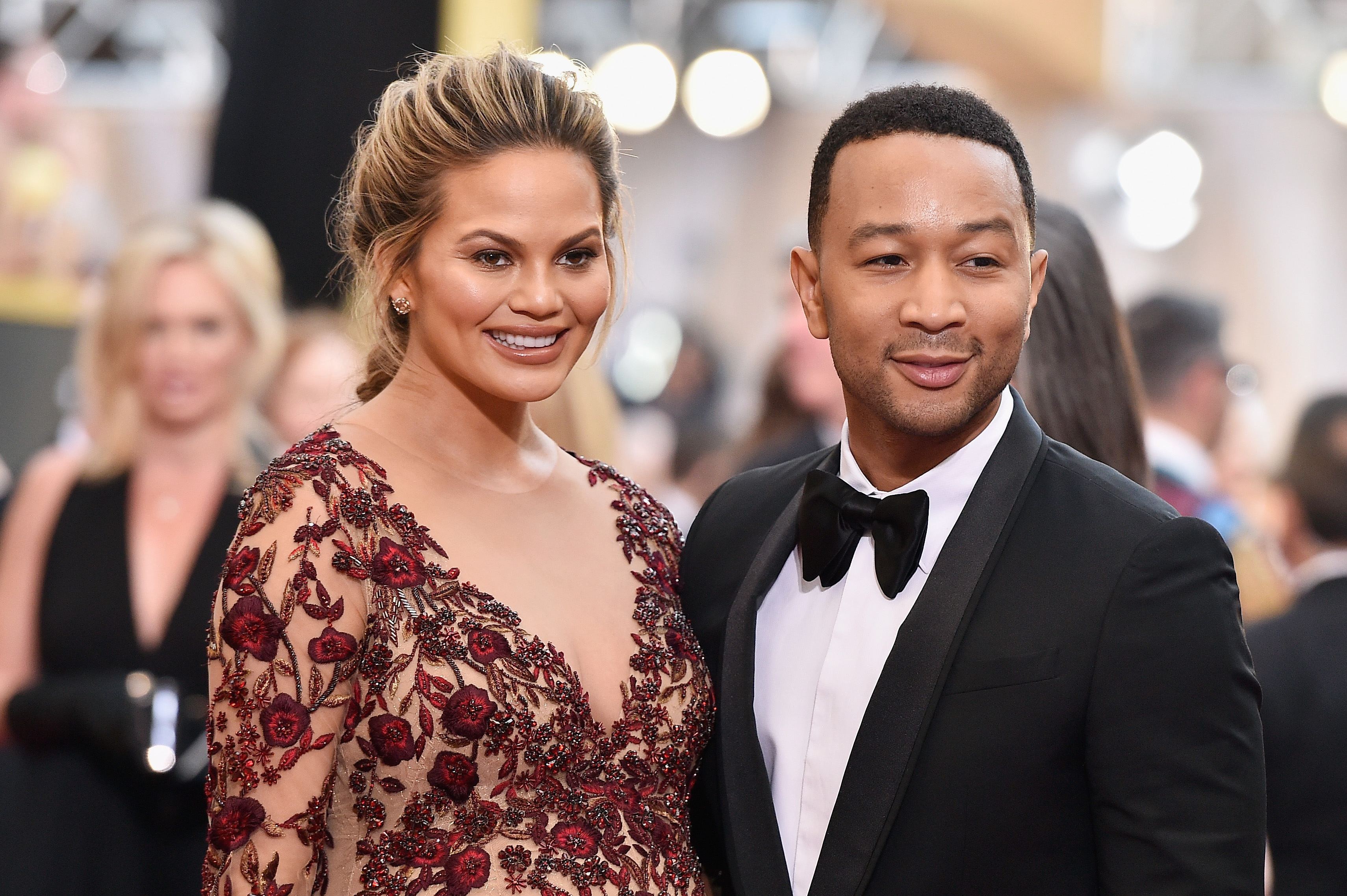 Model Chrissy Teigen (L) and recording artist John Legend attend the 88th Annual Academy Awards. (Photo by Kevork Djansezian/Getty Images)
