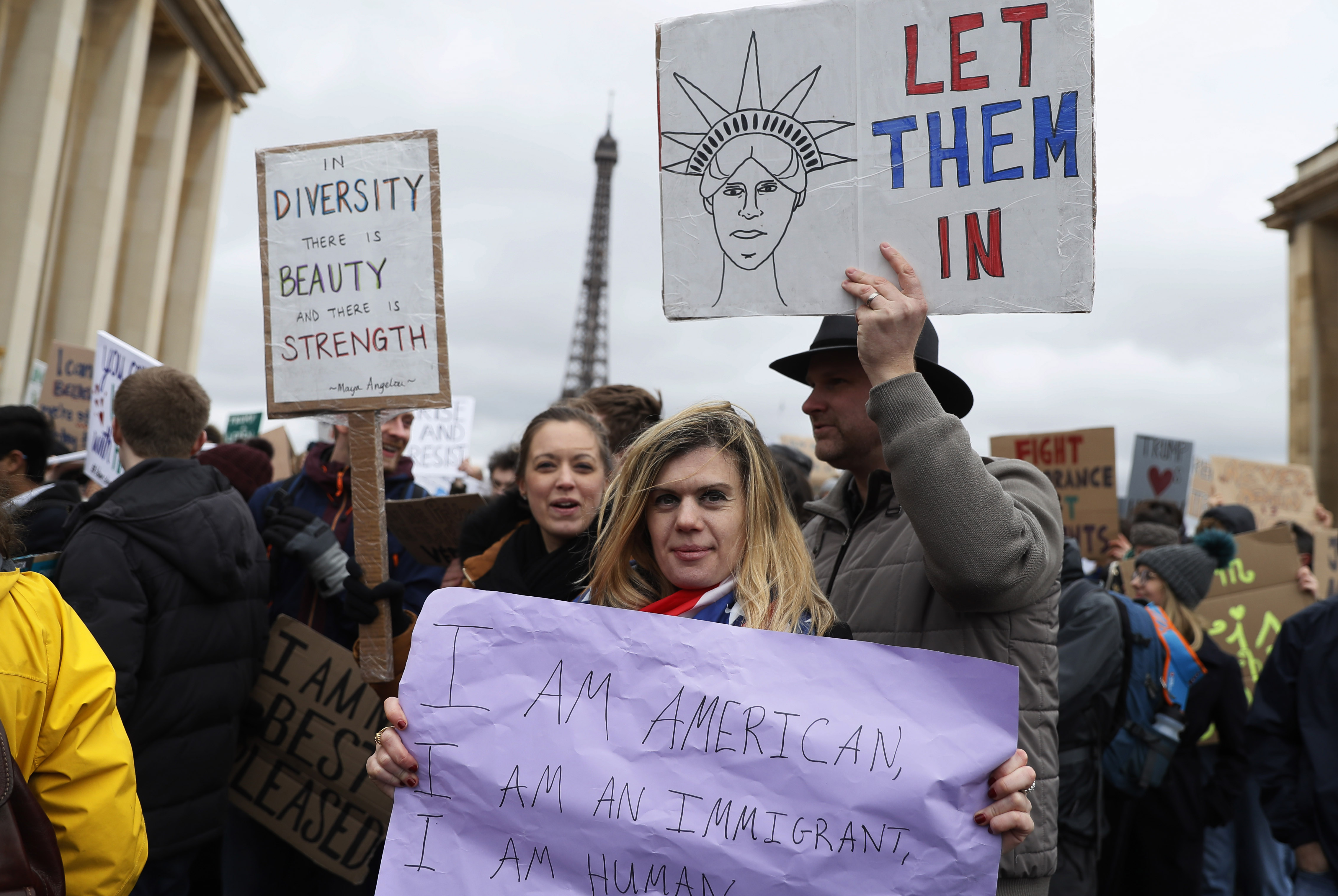 An anti-Trump protester holds a sign during a demonstration in front of the Eiffel Tower in Paris, on February 4, 2017. (THOMAS SAMSON/AFP/Getty Images)