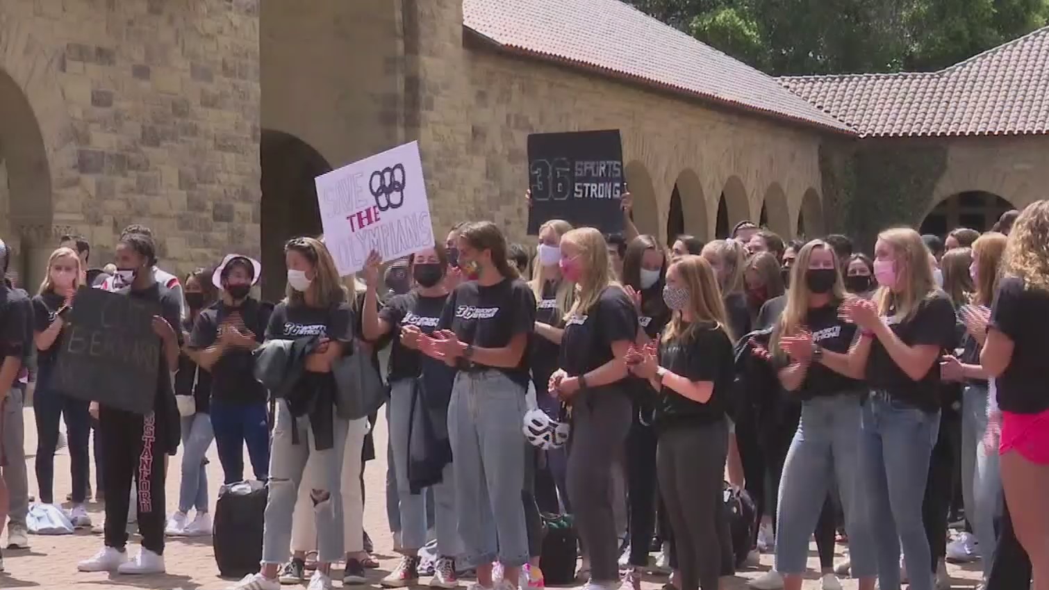 Supporters of recently cut Stanford athletic programs gather outside the university president's office on April 26, 2021. (CBS)
