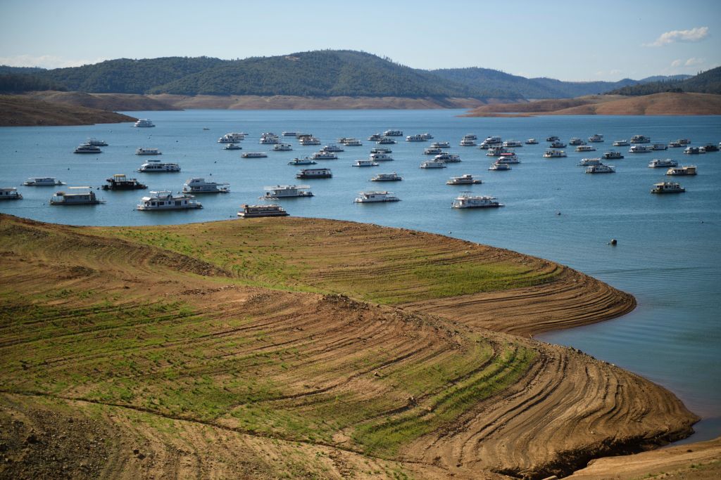 Houseboats are moored on the Lake Oroville reservoir during the California drought emergency on May 24, 2021 in Oroville. Summer has not even begun and Lake Oroville, the second-largest reservoir in California that provides drinking water to more than 25 million people, is at less than half of its average capacity at this time of year. It is a worrying indication of the worsening drought conditions in the northern part of the Golden State. (PATRICK T. FALLON/AFP via Getty Images)