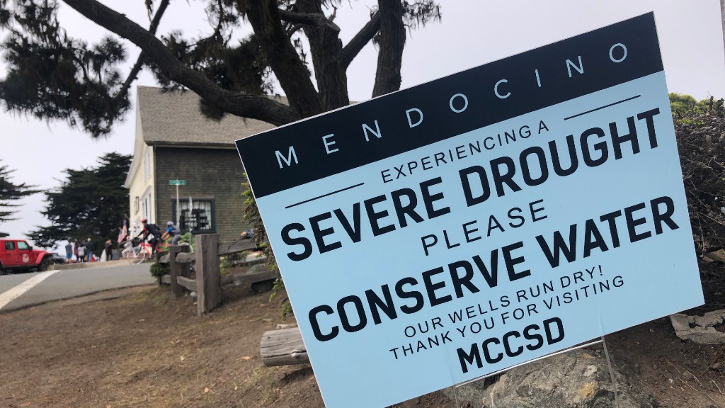 Signs alert visitors to the severe drought in Mendocino on Wednesday, Aug. 4, 2021. Tourists flock to the picturesque coastal town of Mendocino for its Victorian homes and cliff trails, but visitors this summer will also find public portable toilets and dozens of signs on picket fences announcing the quaint Northern California hamlet: "Severe Drought Please conserve water." (AP Photo/Haven Daley)