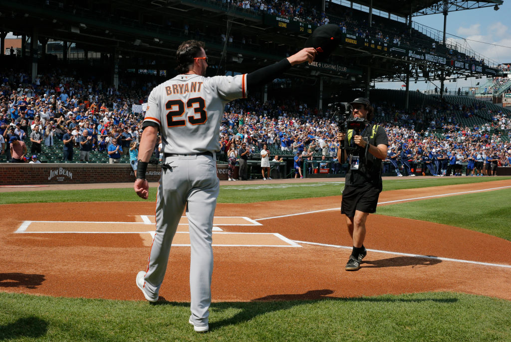 Kris Bryant #23 of the San Francisco Giants waves to the fans during a standing ovation following a video tribute in his honor prior to a game against the Chicago Cubs at Wrigley Field on September 10, 2021 in Chicago. Today's game was Bryant's first time back at Wrigley Field since he was traded by the Cubs. (Nuccio DiNuzzo/Getty Images)
