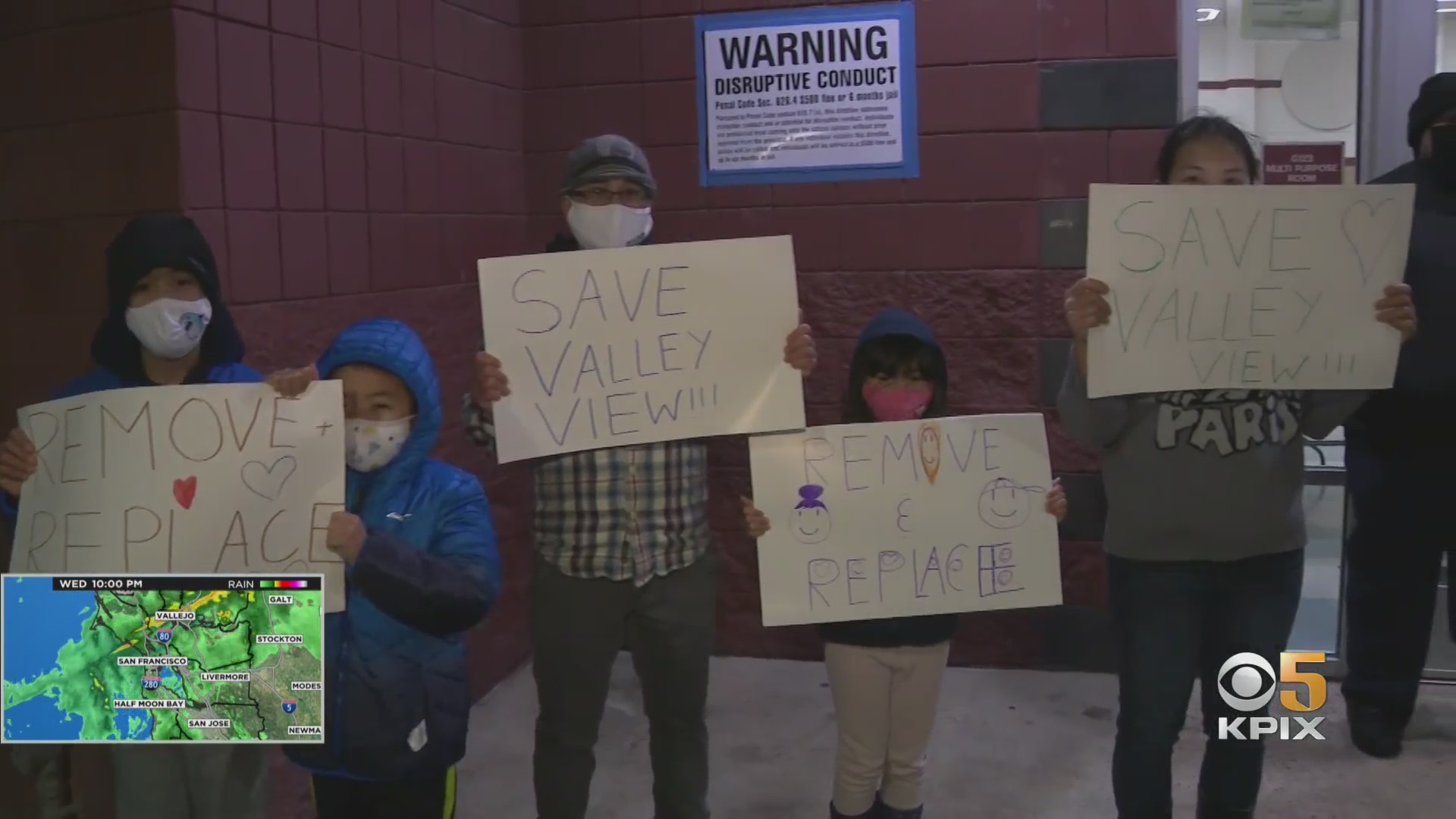 Valley View Elementary parents and students carry signs to a West Contra Costa School Board meeting on December 15, 2021. (CBS)